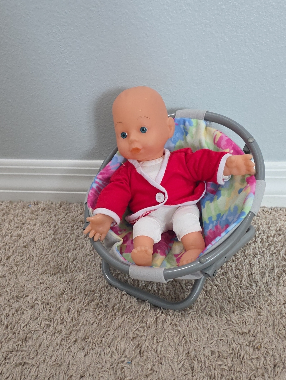 Baby Doll with Red Jacket and Pink Tie Die Chair